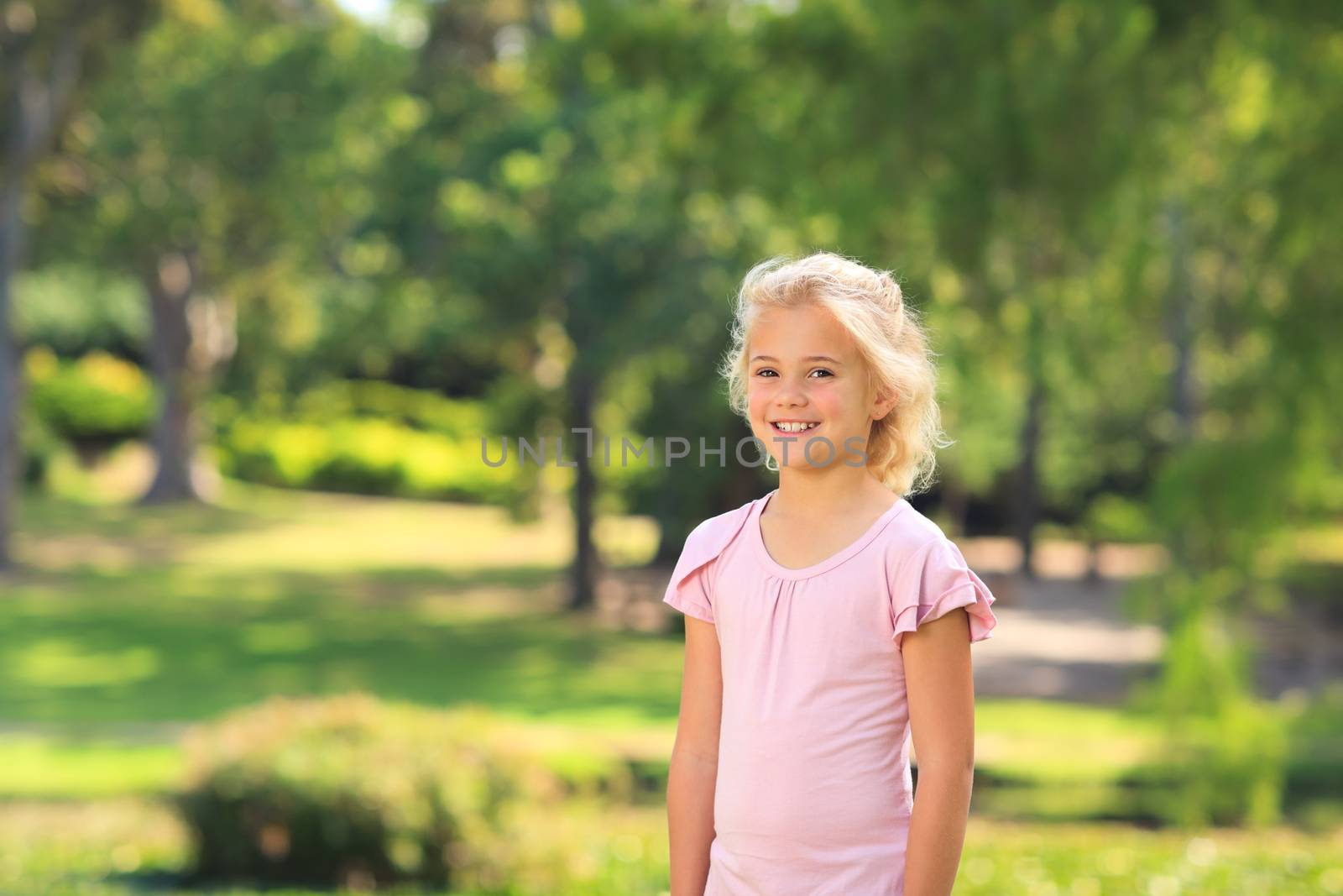 Little girl in the park during the summer by Wavebreakmedia