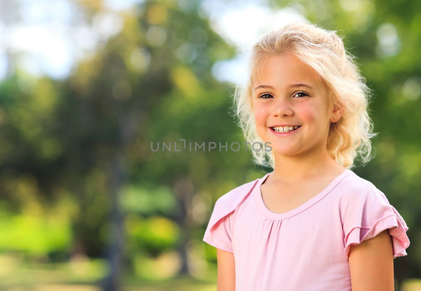 Little girl in the park by Wavebreakmedia