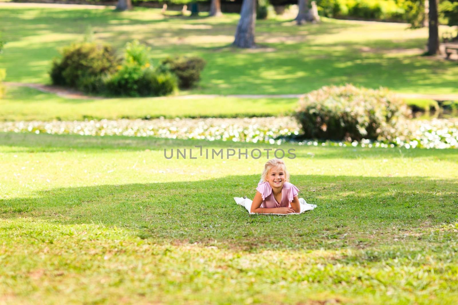 Little girl in the park during the summer