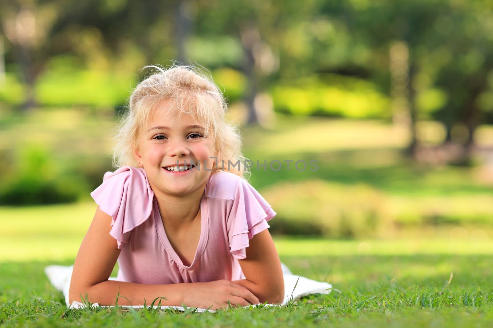 Little girl in the park during the summer