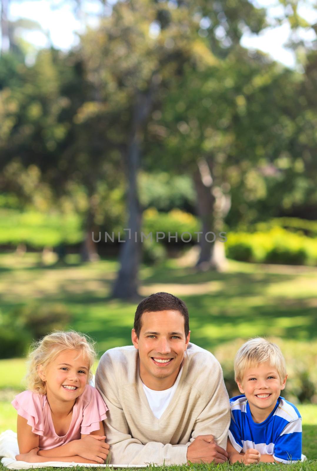 Father with his children in a park by Wavebreakmedia