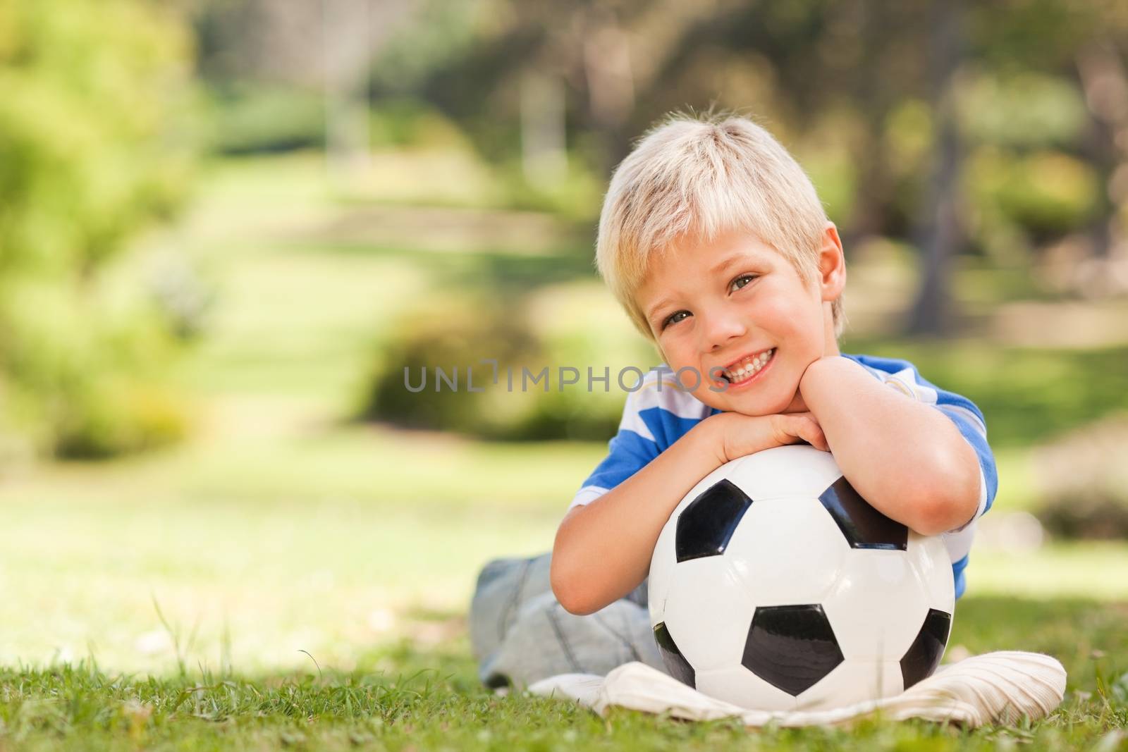 Boy with his ball in the park by Wavebreakmedia