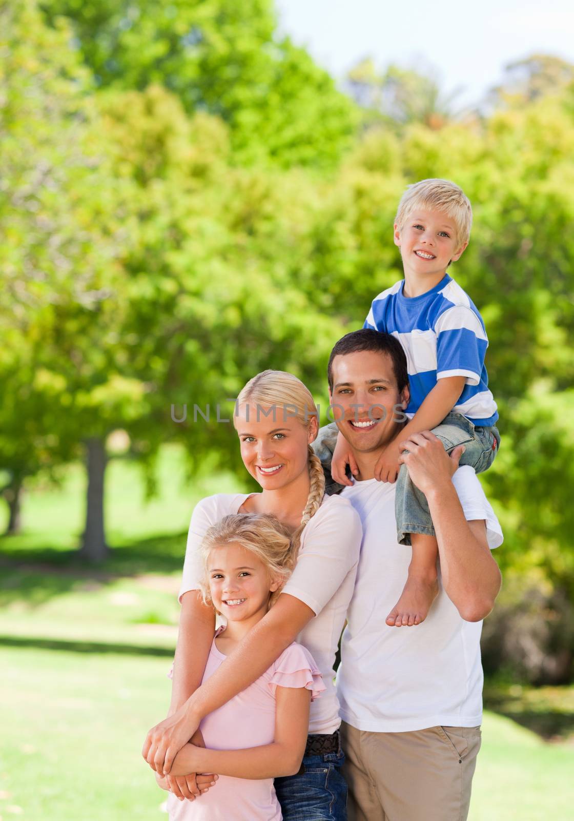 Happy family in the park during the summer