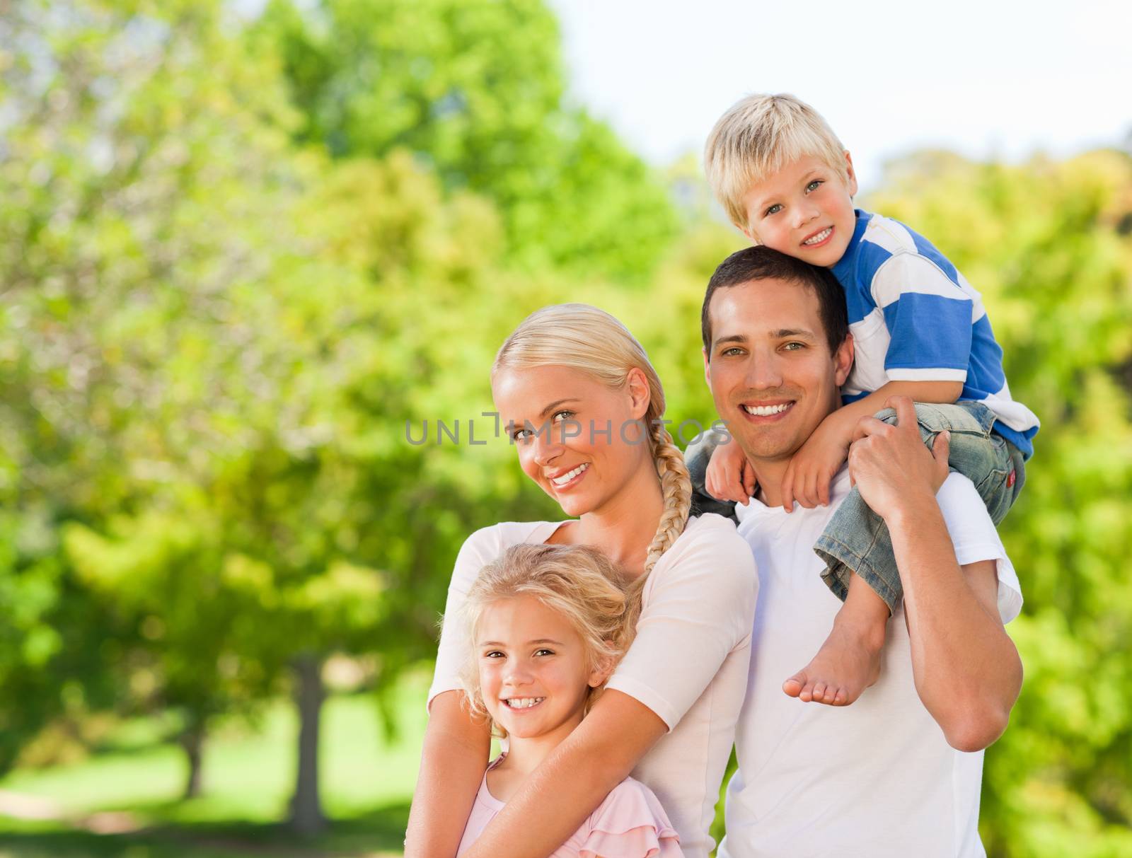 Happy family in the park during the summer