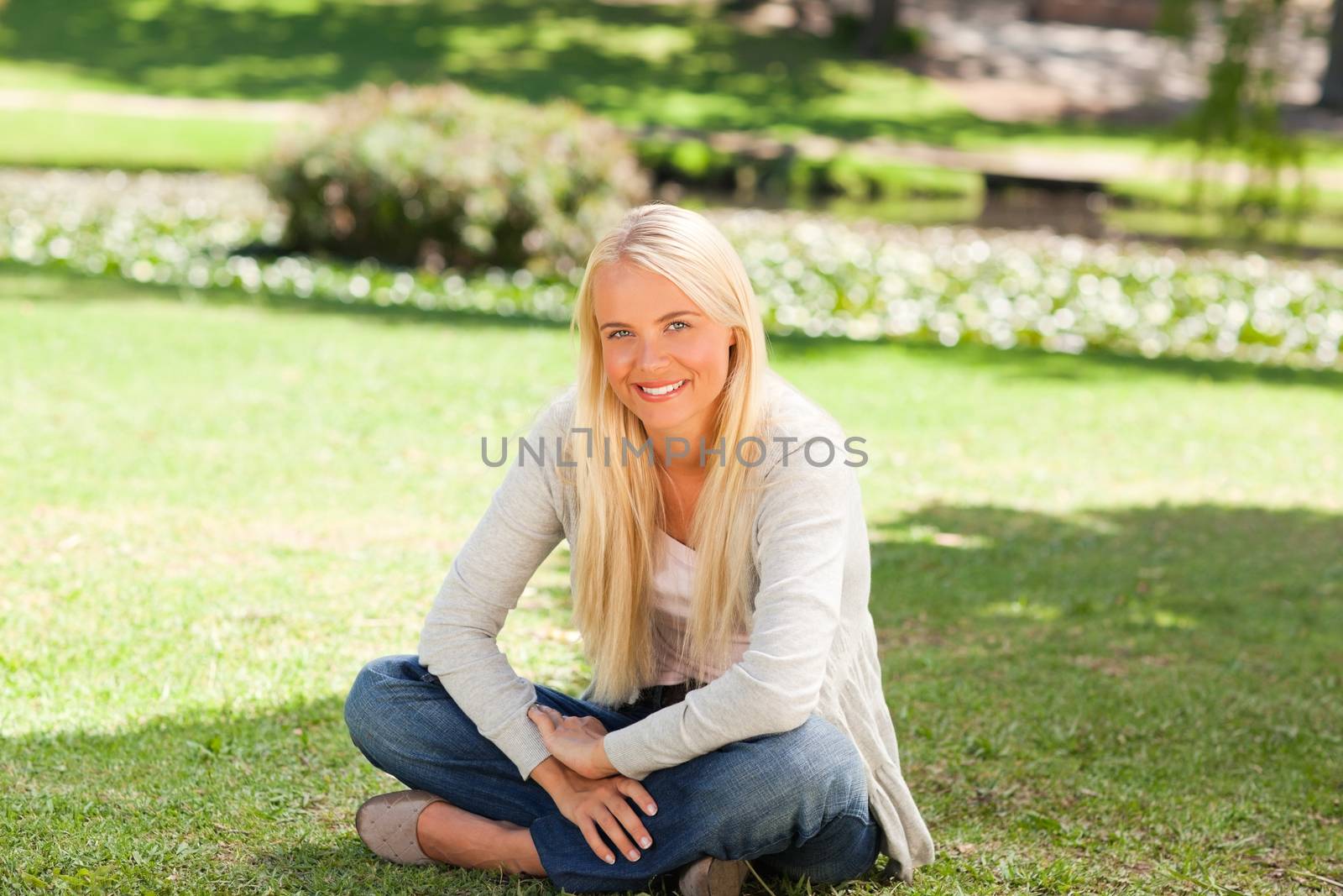 Woman sitting in the park by Wavebreakmedia