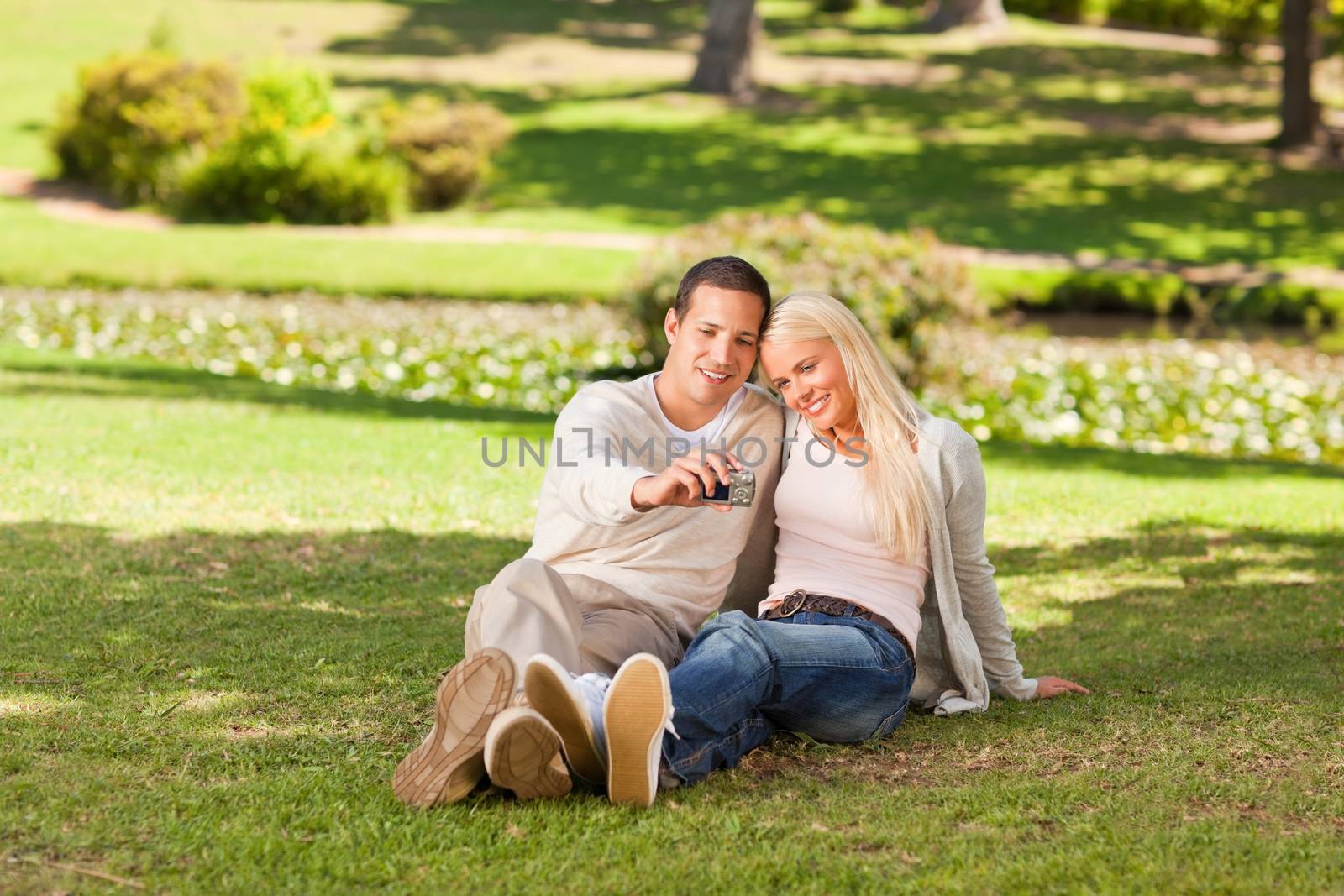 Young couple taking a photo of themselves during the summer 