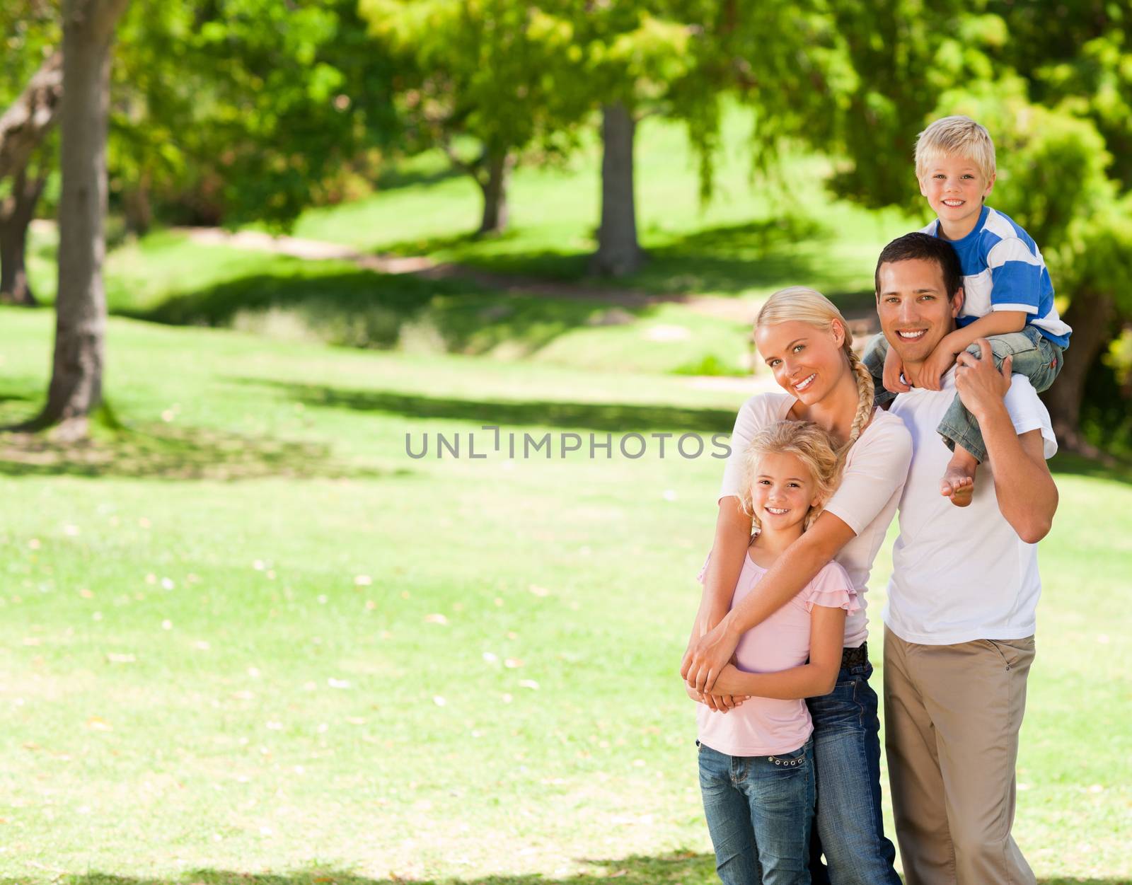 Happy family in the park during the summer