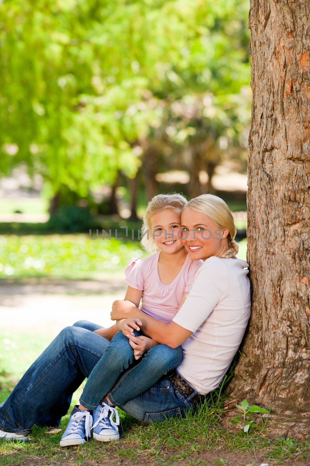 Lovely mother with her daughter during the summer in a park