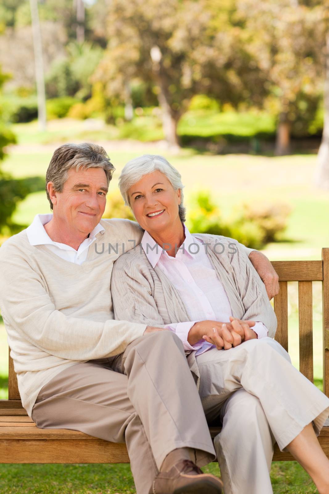 Senior couple on the bench in a park by Wavebreakmedia
