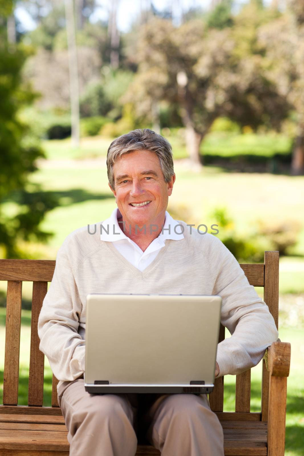 Senior man working on his laptop by Wavebreakmedia