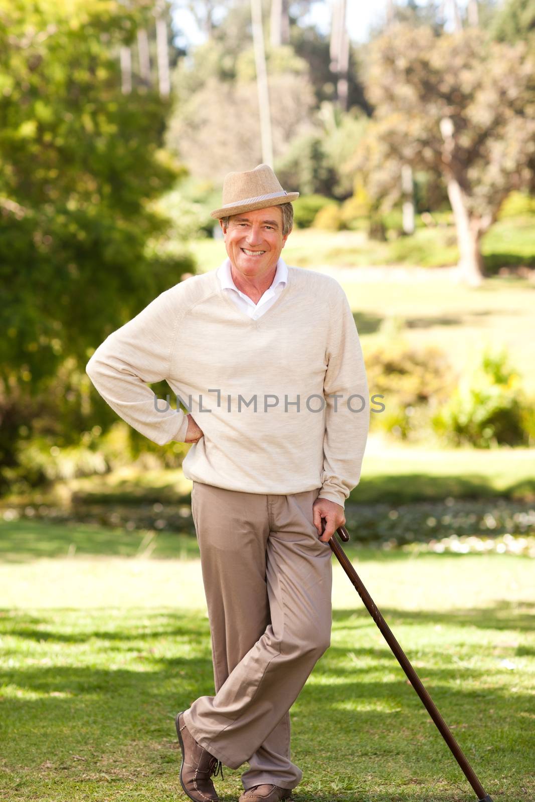 Senior man posing in front of the camera during the summer