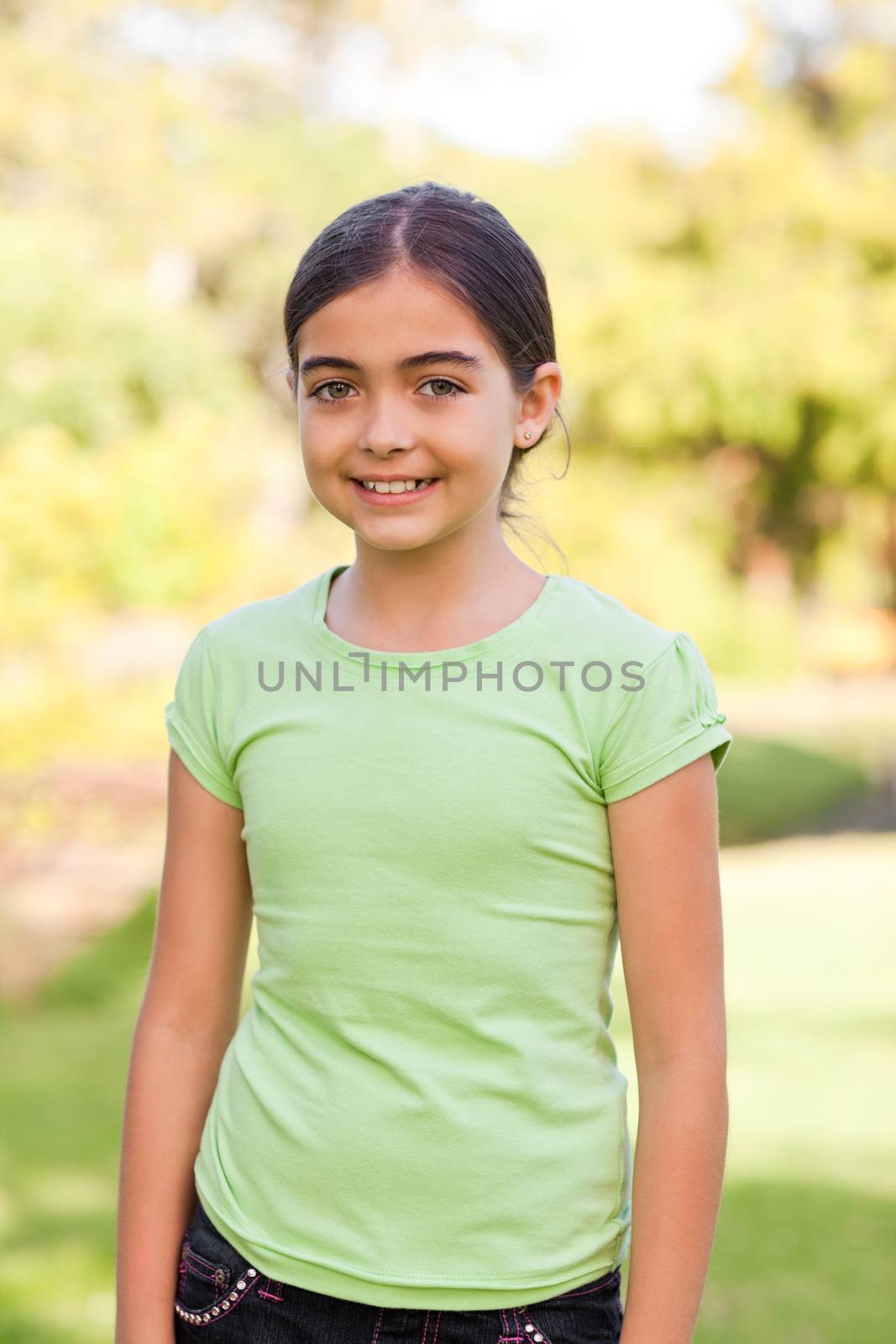 Cute girl in the park during the summer
