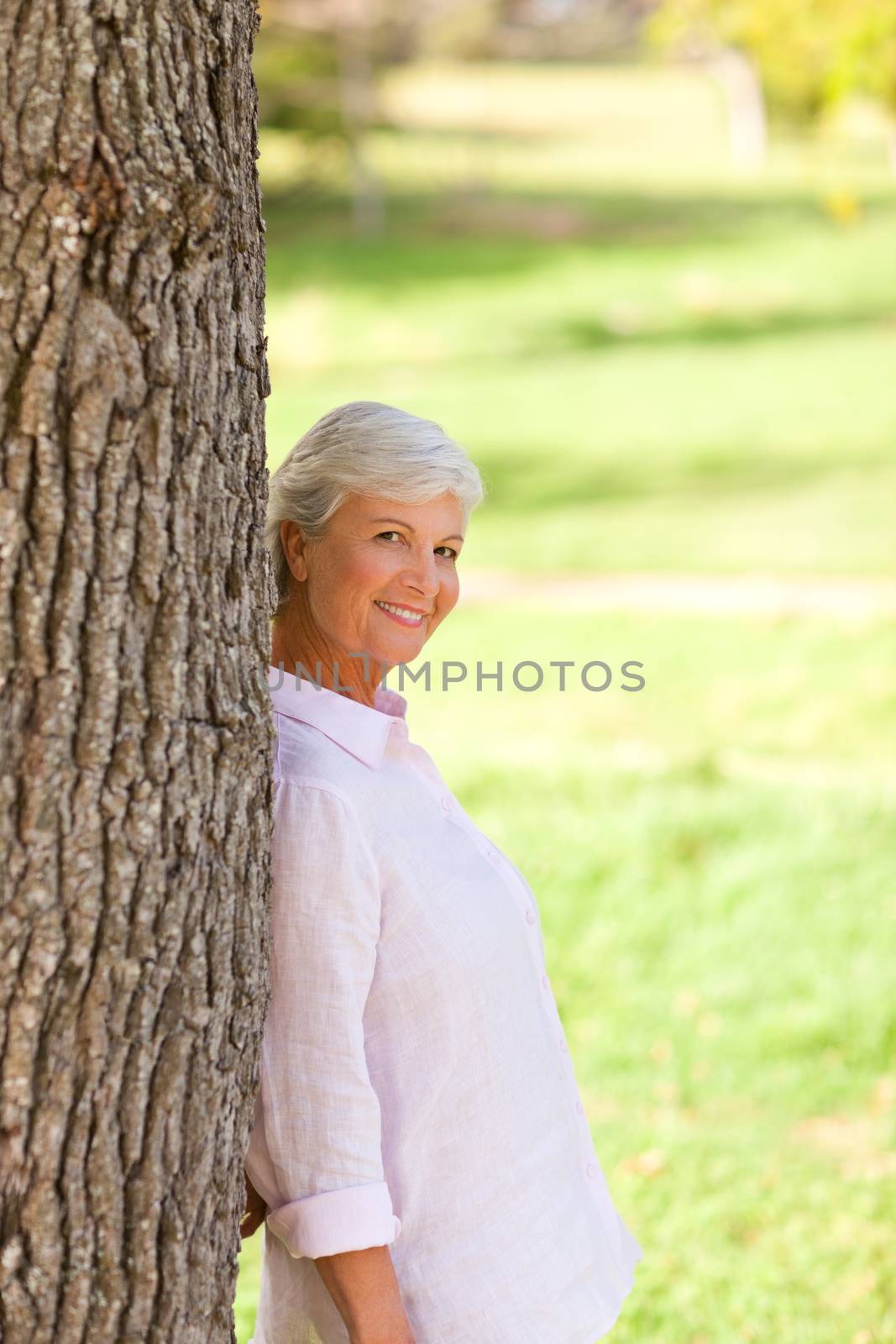 Senior woman in the park during the summer