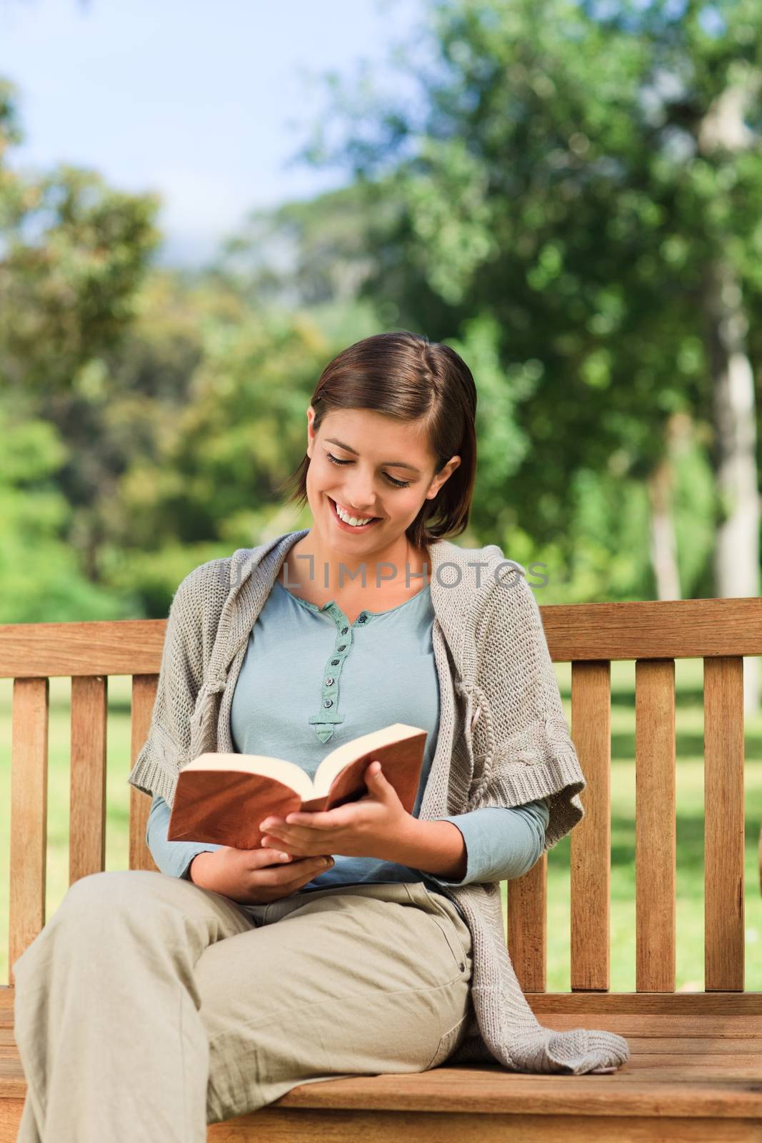Lovely woman reading during the summer