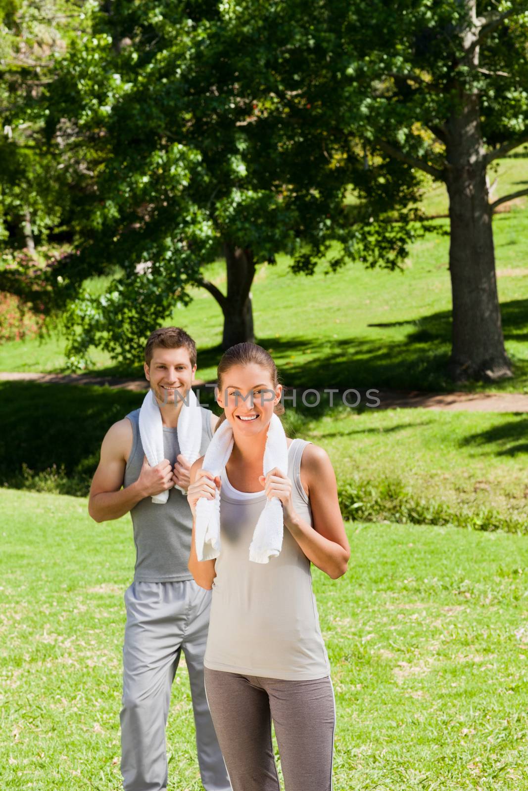 Exhausted couple in the park by Wavebreakmedia