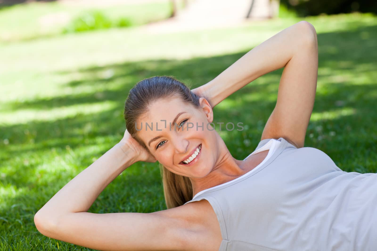 Woman doing her stretches in the park by Wavebreakmedia