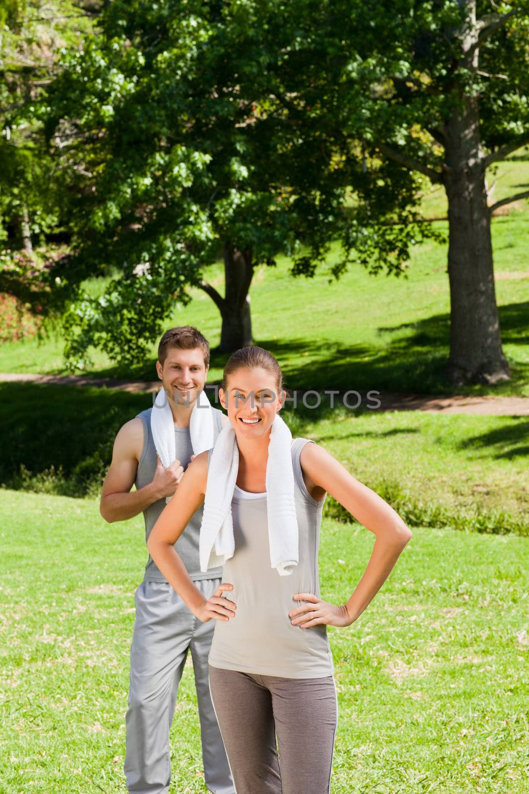 Exhausted couple in the park during the summer
