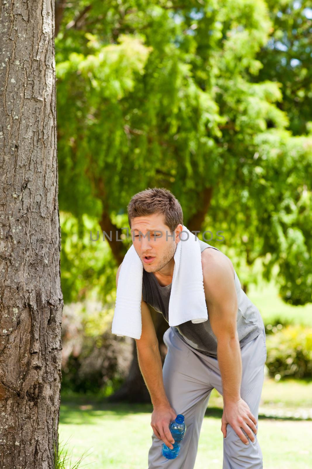 Man exhausted after the gym during the summer