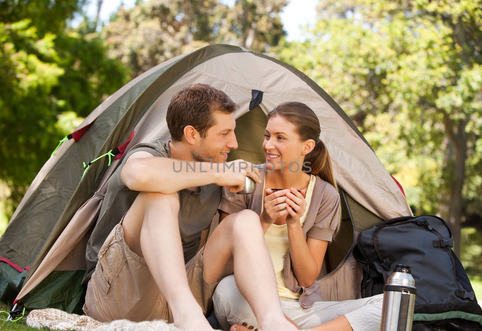 Couple camping in the park during the summer