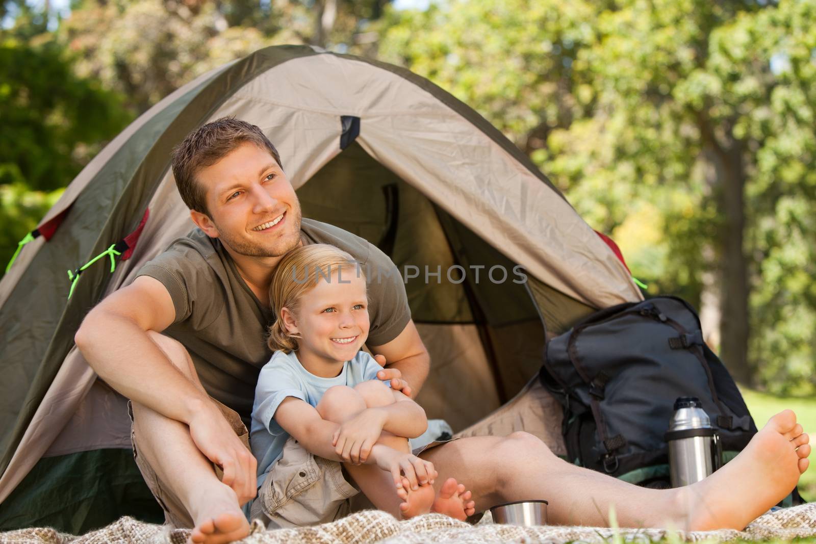 Father and his son camping during the summer