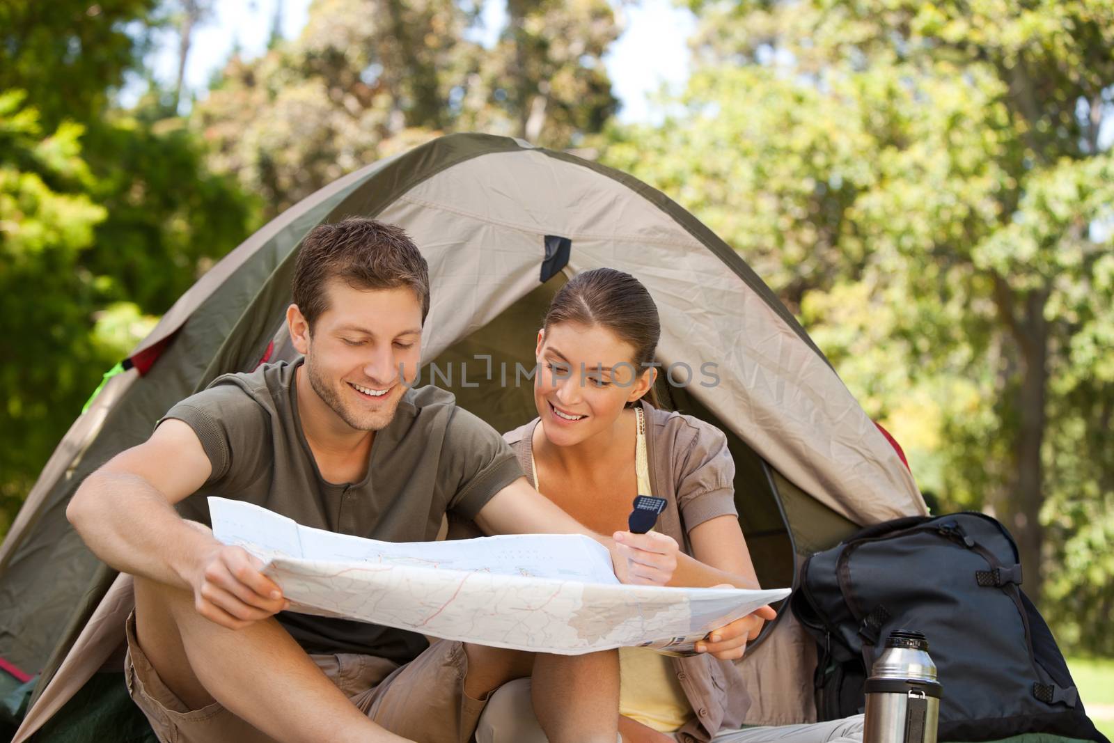 Couple camping in the park by Wavebreakmedia