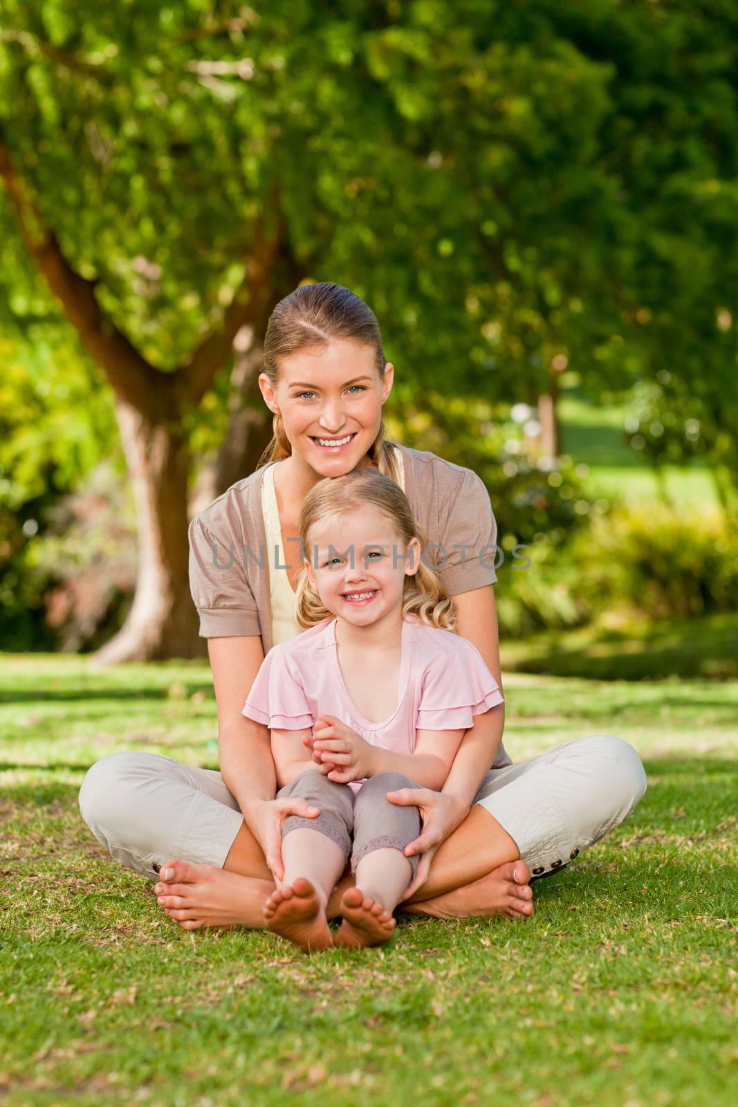 Daughter with her mother in the park during the summer