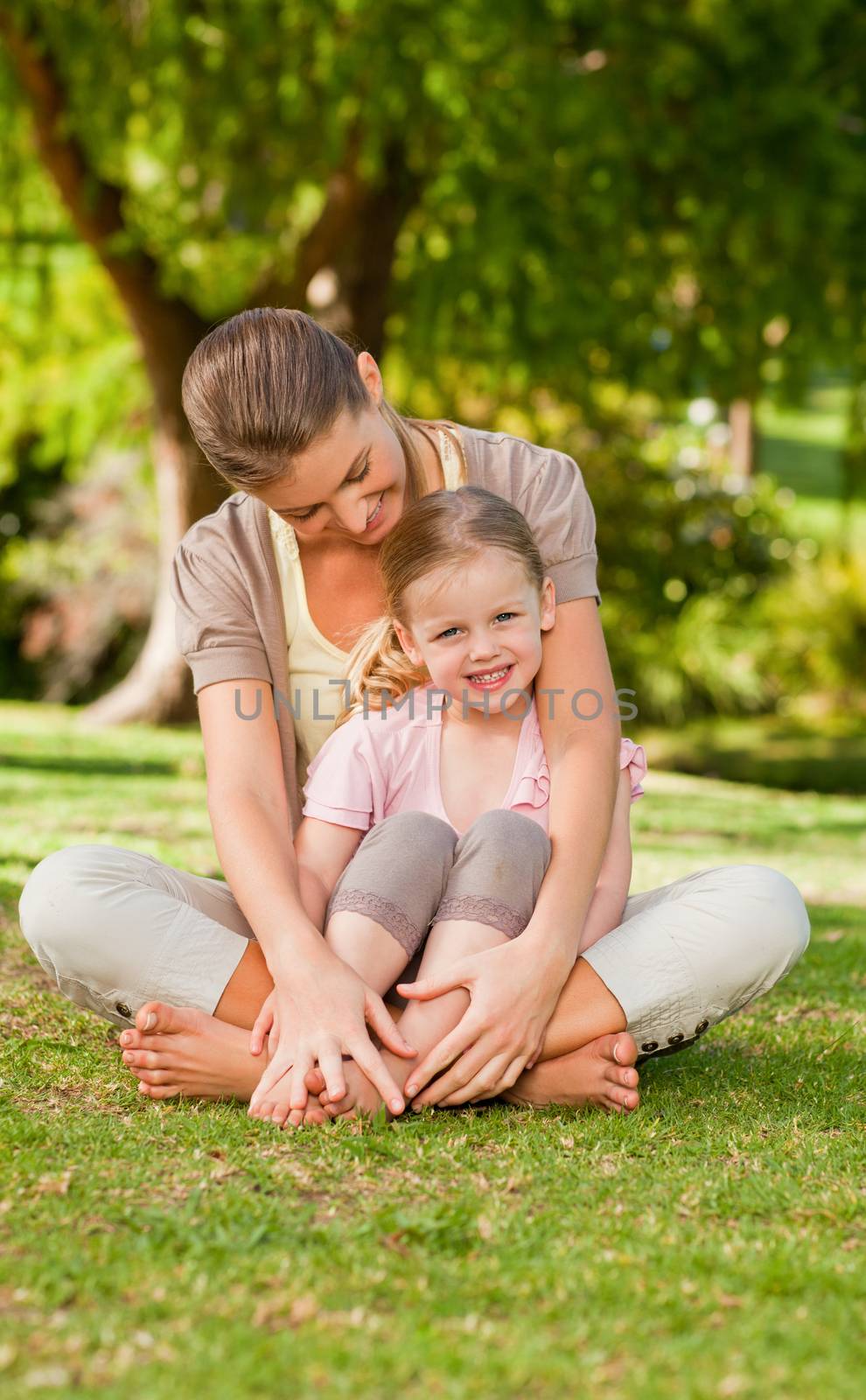 Daughter with her mother in the park during the summer