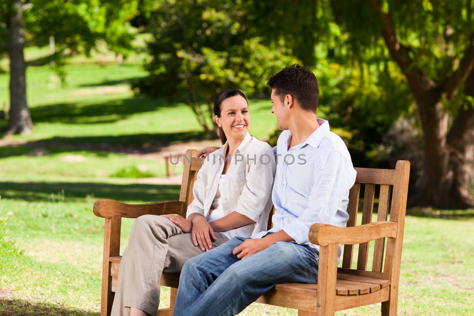 Couple on the bench during the summer