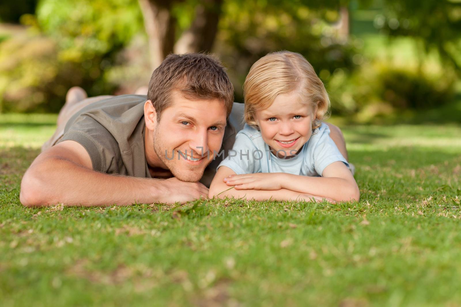 Father and his son in the park during the summer