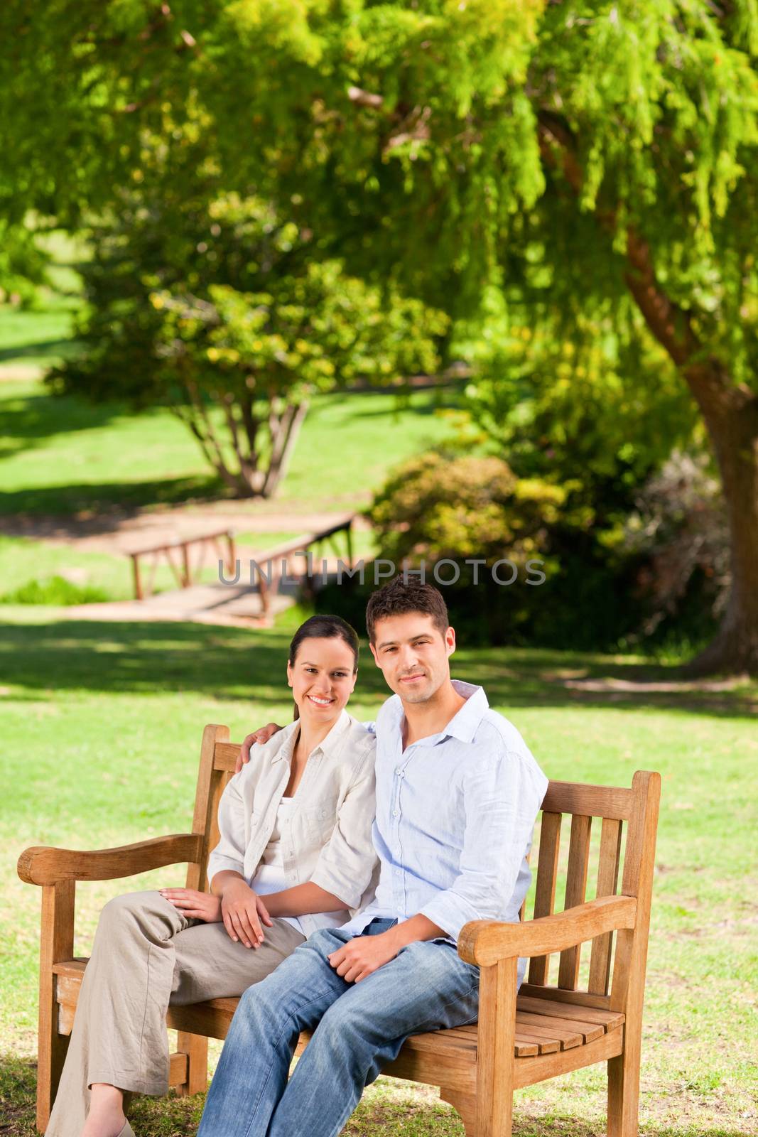 Couple on the bench during the summer