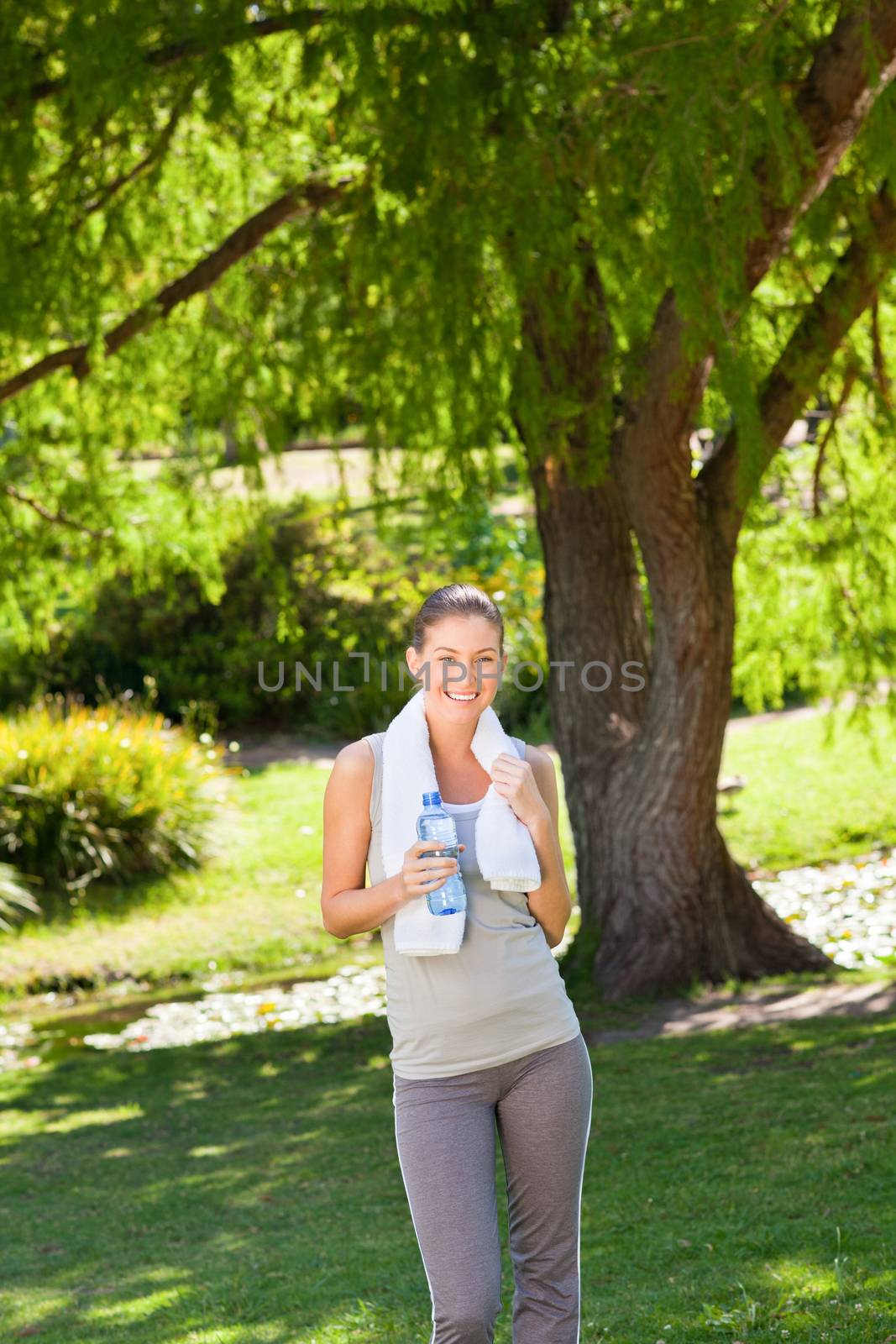 Woman drinking water after the gym by Wavebreakmedia