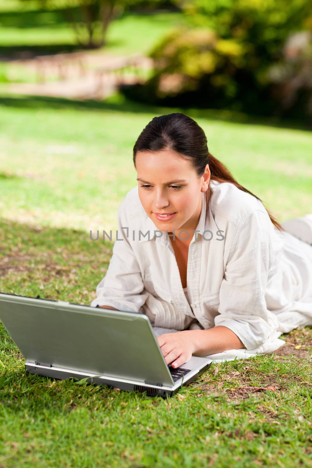 Woman working on her laptop by Wavebreakmedia