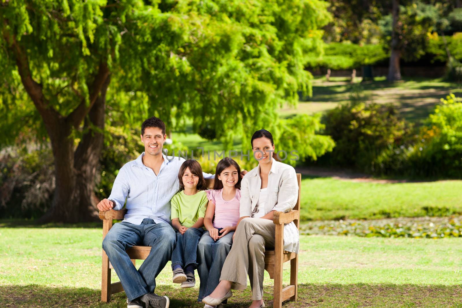 Family on the bench in a park