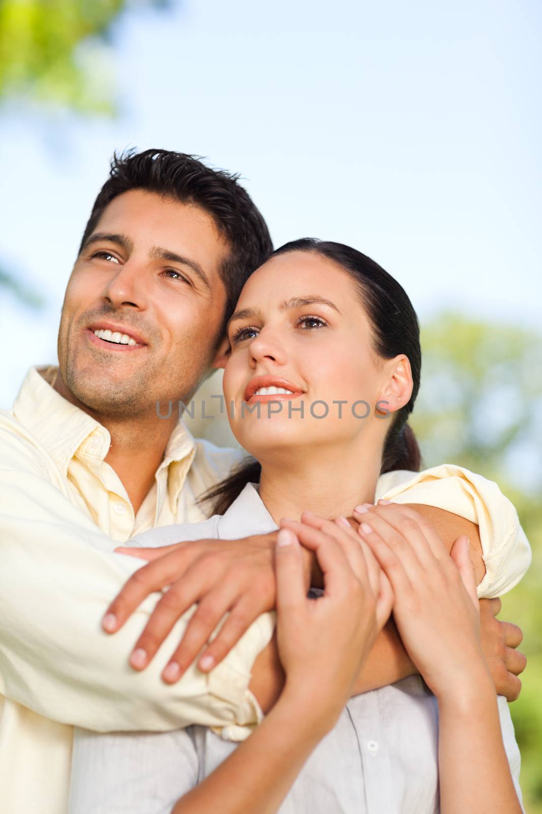 Happy couple in the park during the summer