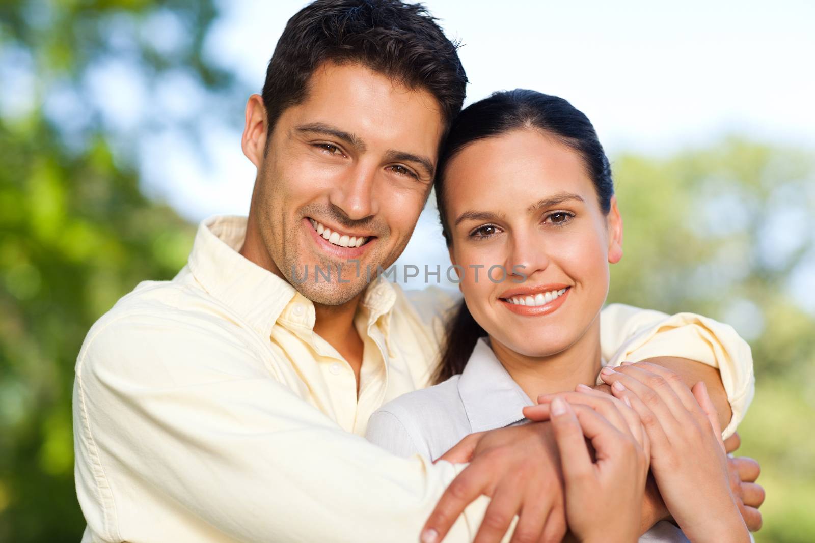 Happy couple in the park during the summer