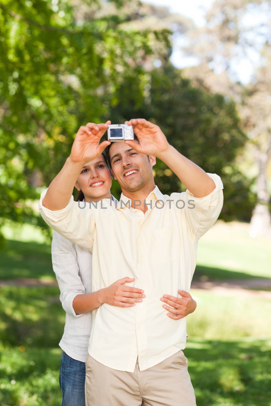 Couple taking a photo of themselves by Wavebreakmedia