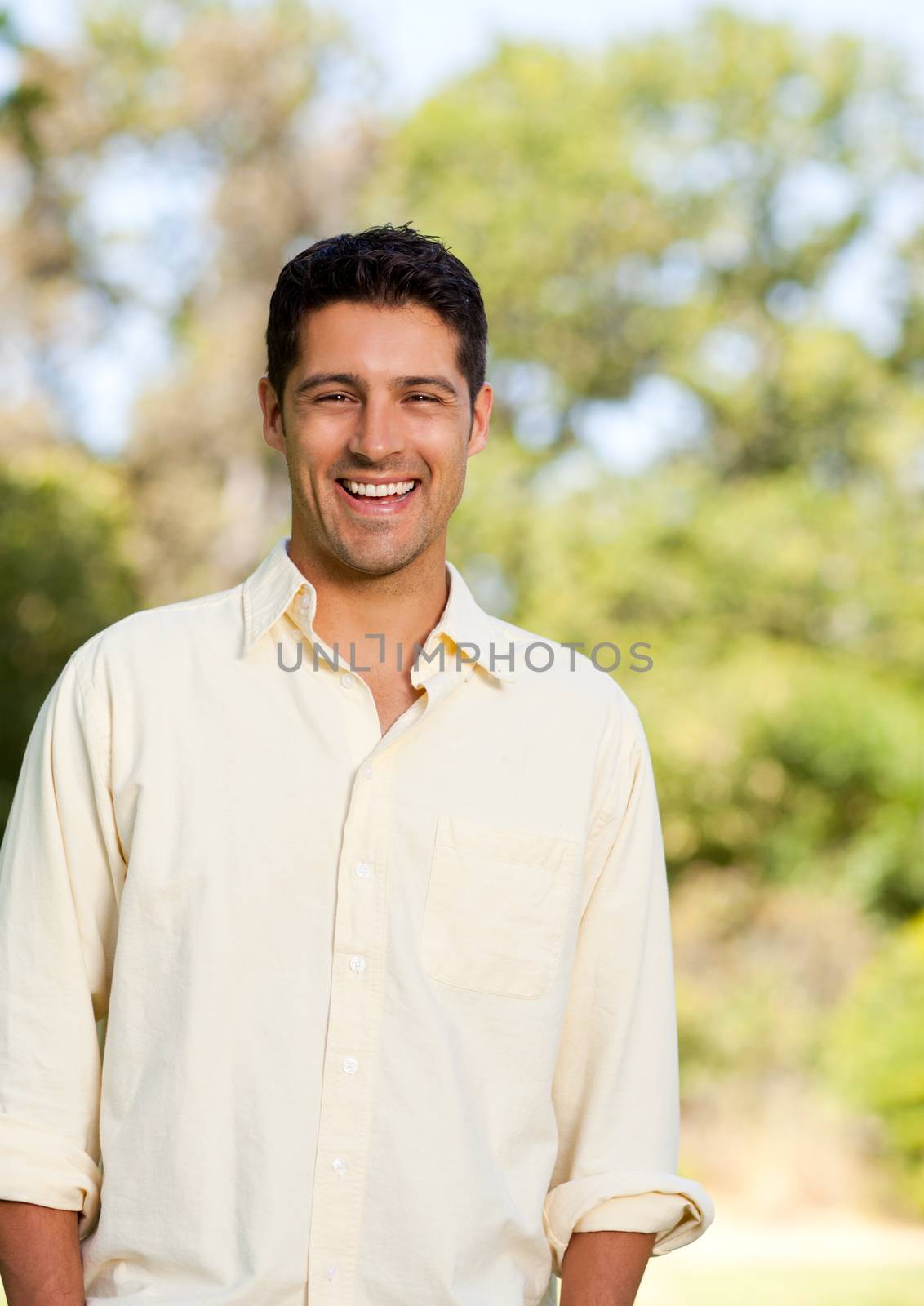 Handsome man in the park during the summer 