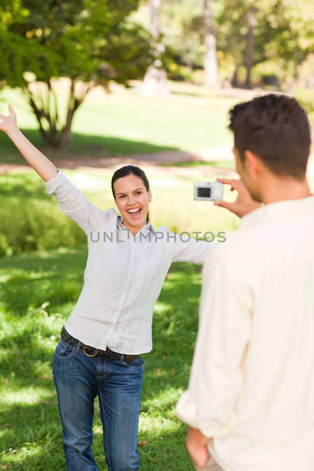 Man taking a photo of his girlfriend by Wavebreakmedia