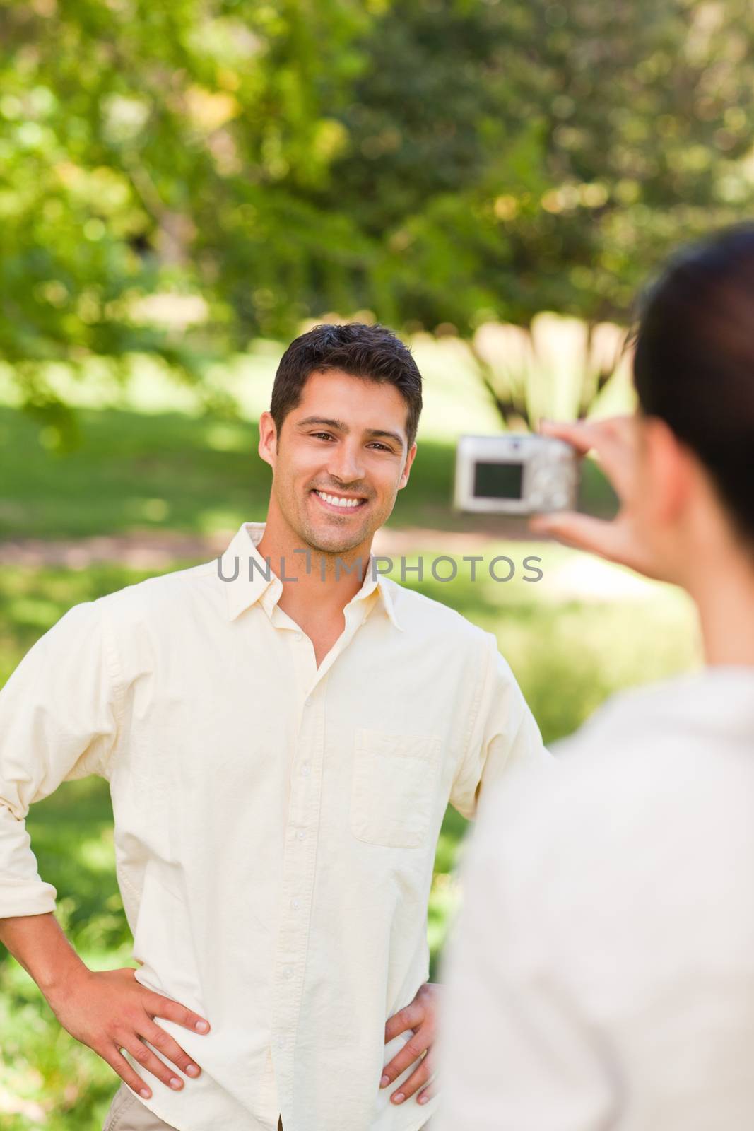Woman taking a photo of her boyfriend by Wavebreakmedia