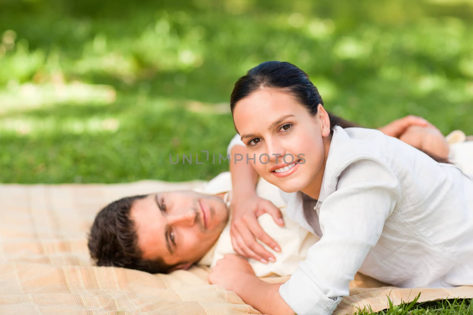 Beautiful woman with her husband in a park