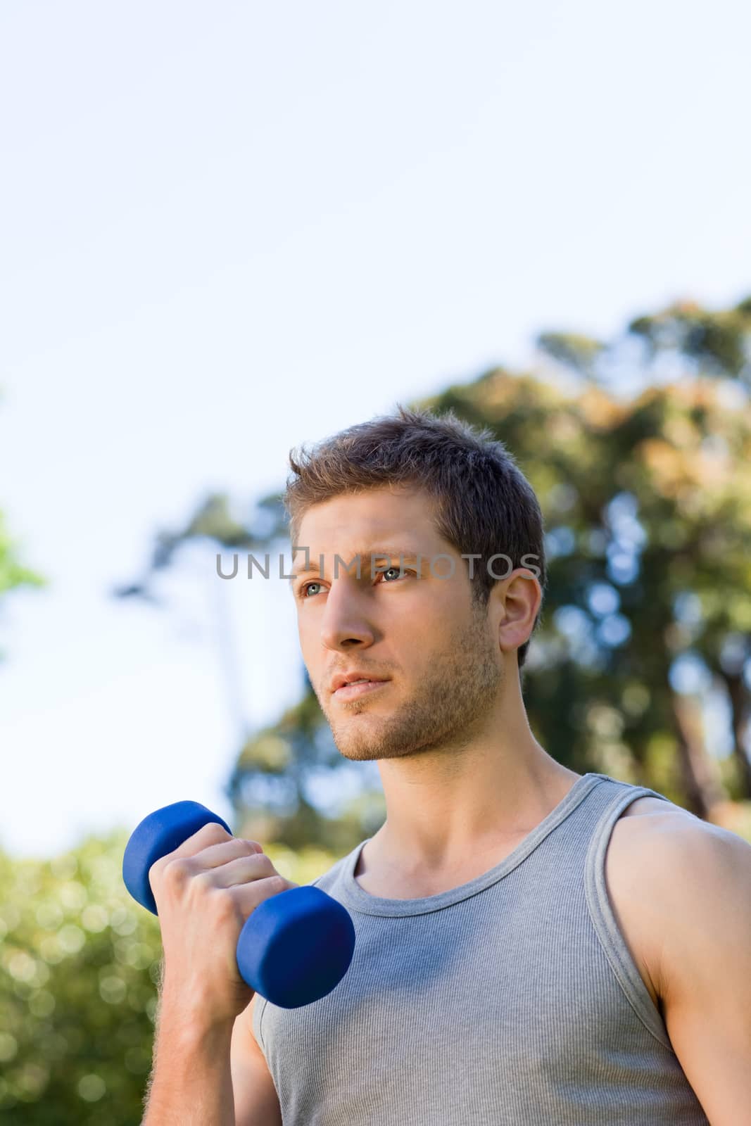 Man doing his exercises in the park during the summer