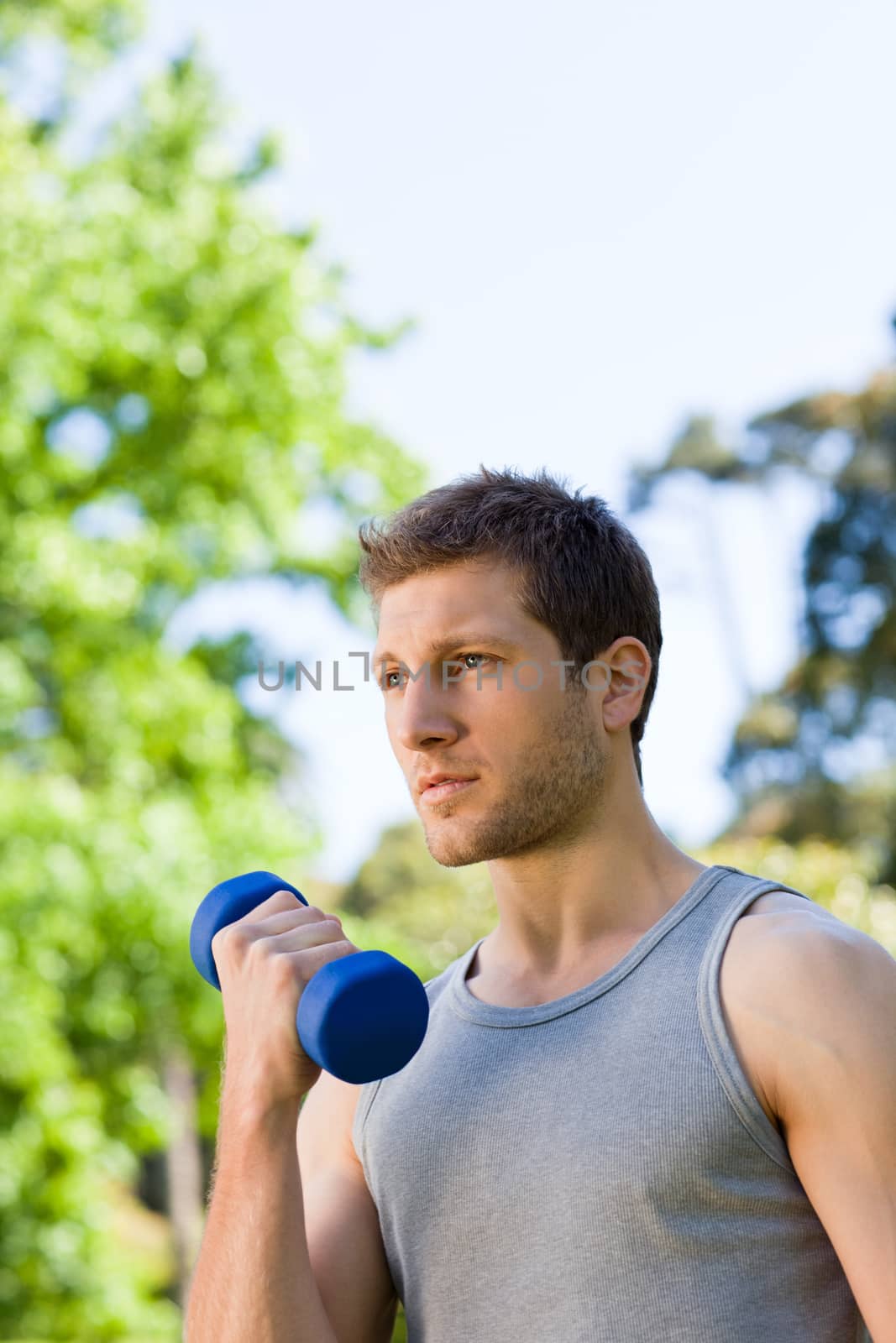 Man doing his exercises in the park by Wavebreakmedia