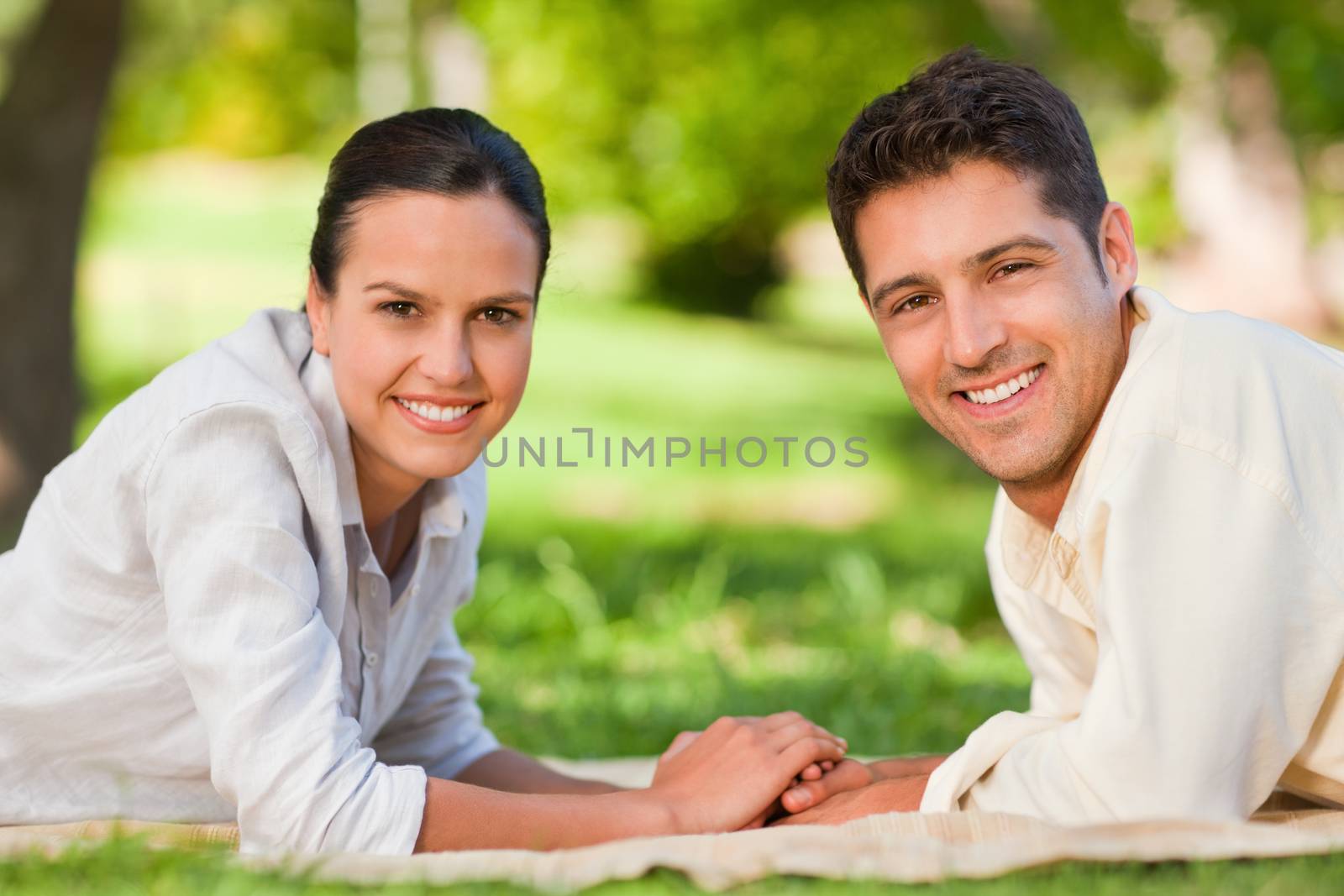 Enamored couple in the park during the summer