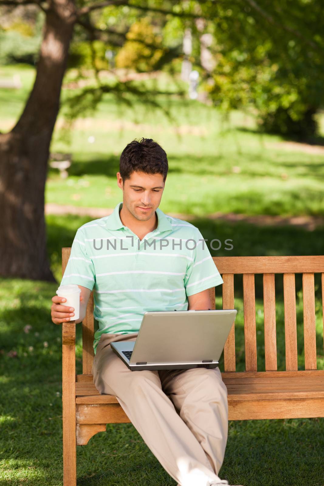 Man working on his laptop by Wavebreakmedia