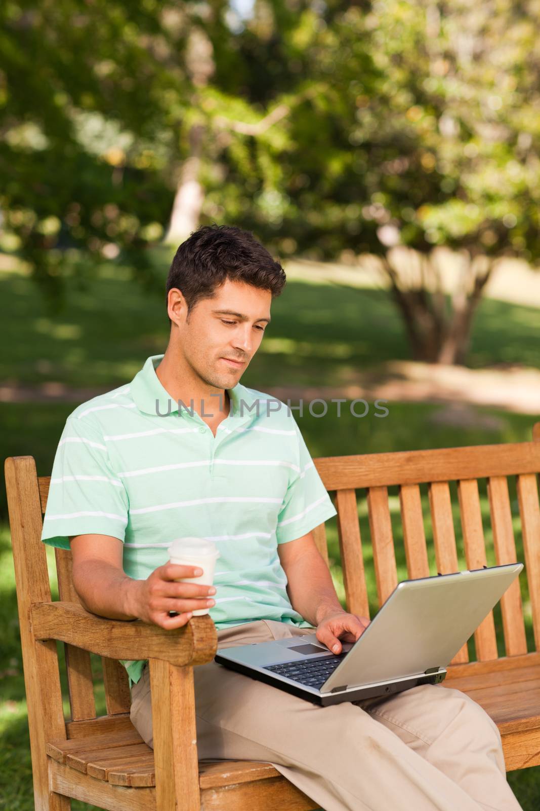 Man working on his laptop by Wavebreakmedia
