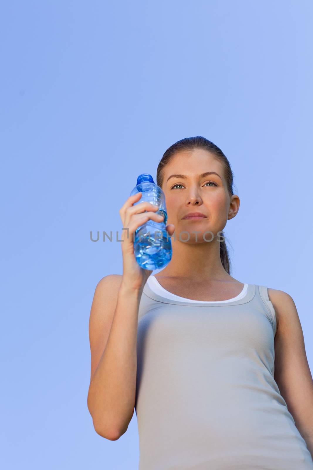 Young woman drinking water by Wavebreakmedia