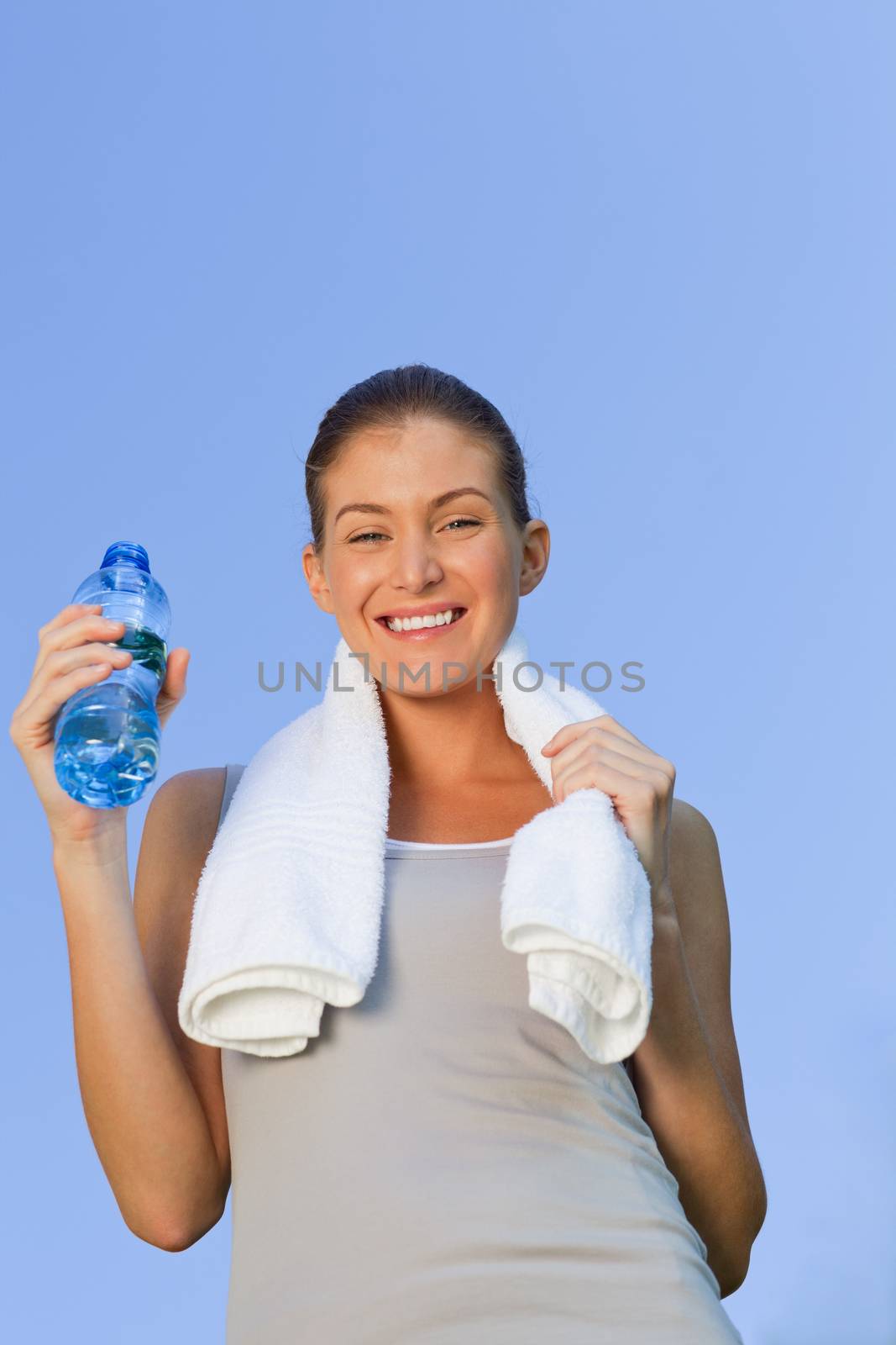 Young woman drinking water by Wavebreakmedia