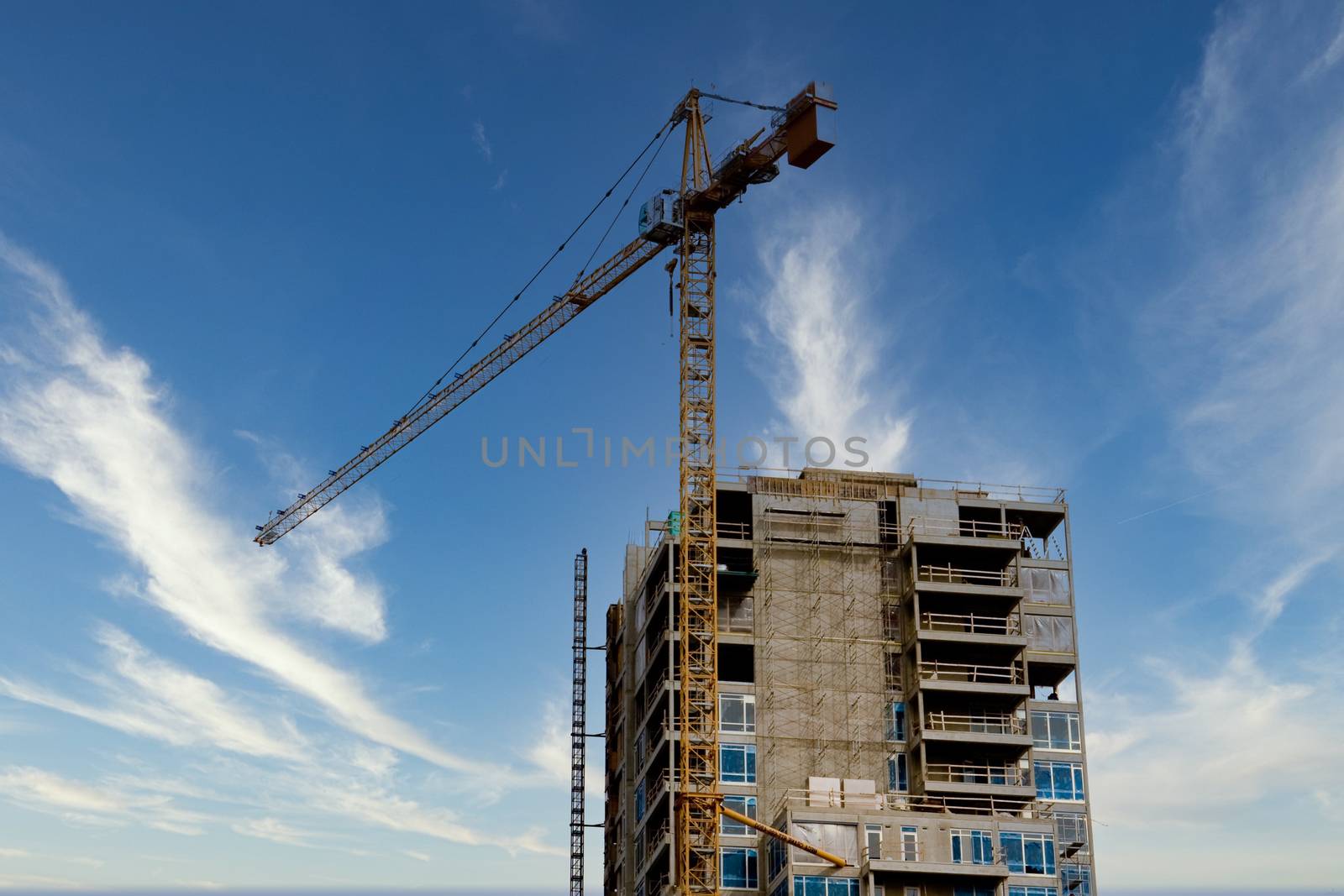 A crane atop a new high rise construction project