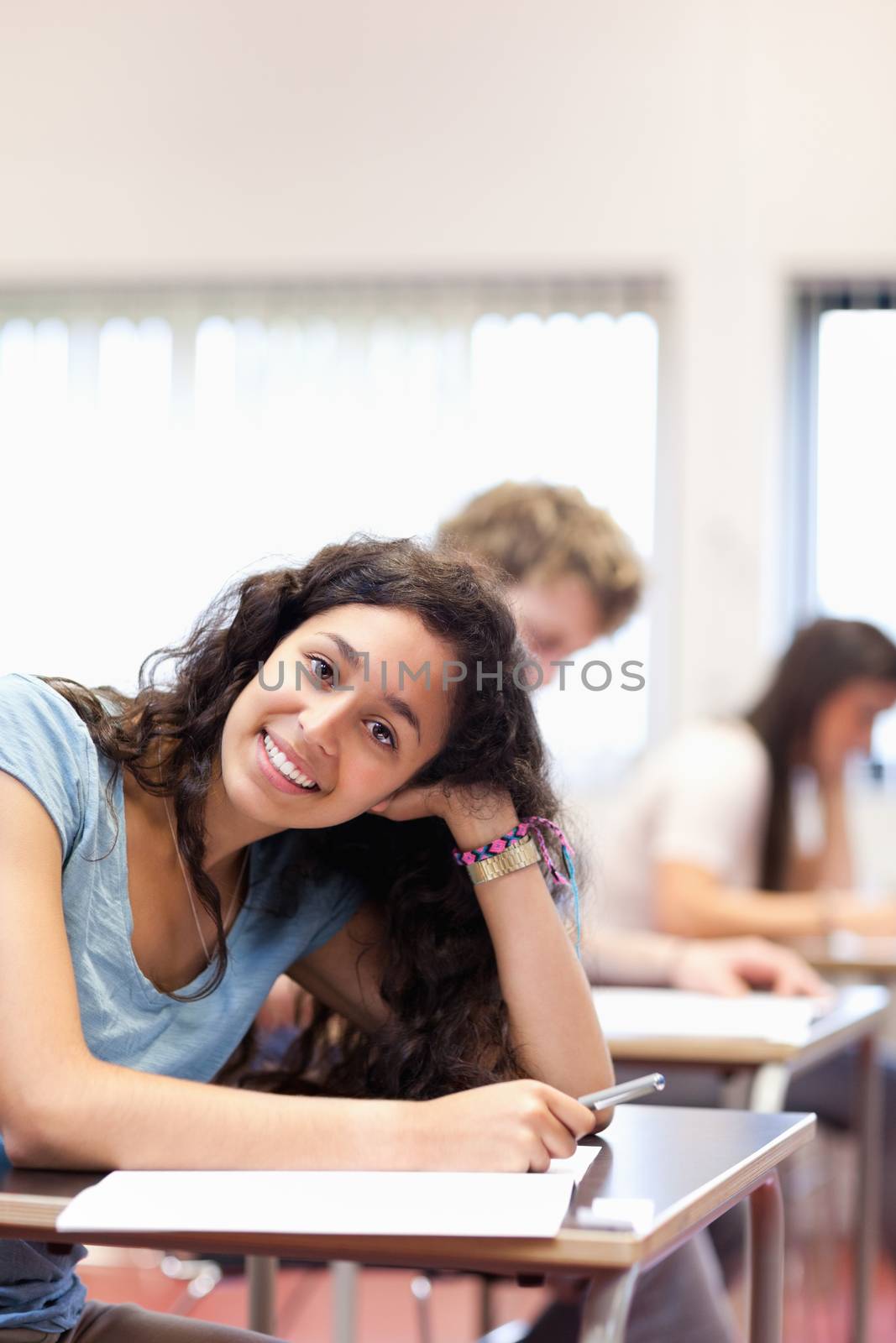 Portrait of a smiling young student posing by Wavebreakmedia