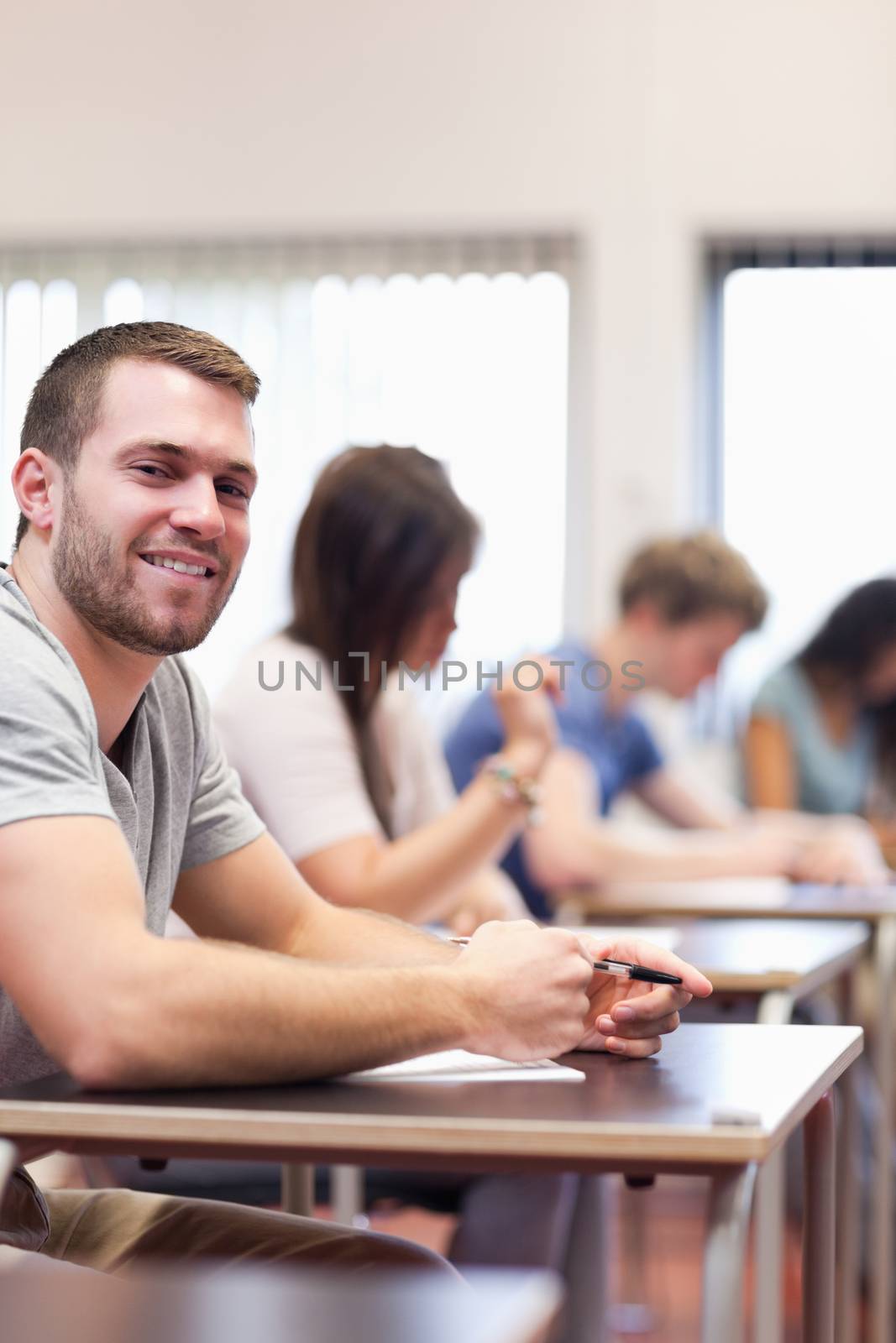 Portrait of a smiling young man by Wavebreakmedia